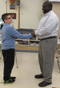 Denis Okema receives thanks after leading a classroom discussion about reconciliation as a strategy to resolve conflict.