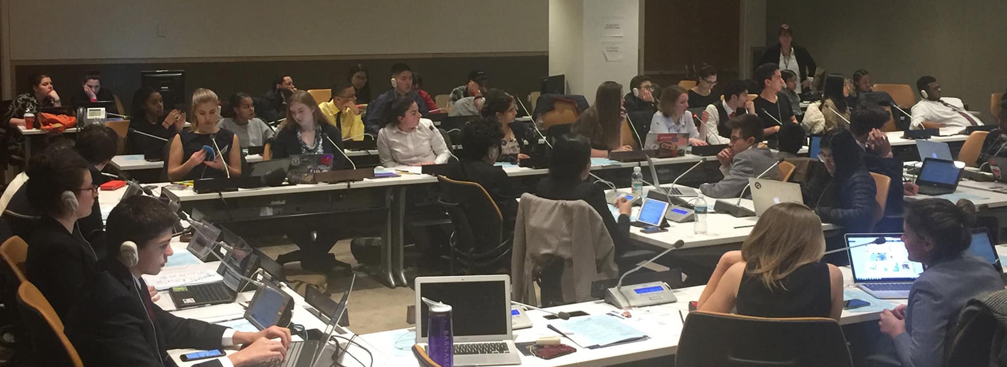 Cornell Students (seated) discuss their participation in the 2017 COP23 Climate Change Conference held in Bonn, Germany.