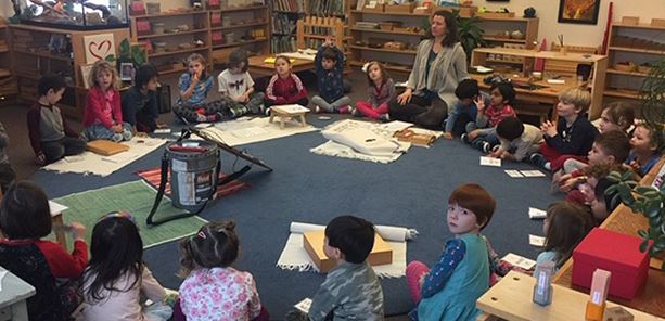 Montessori teacher Virginia Spiers guiding students to understand the relation between life skills and the ReUse mission