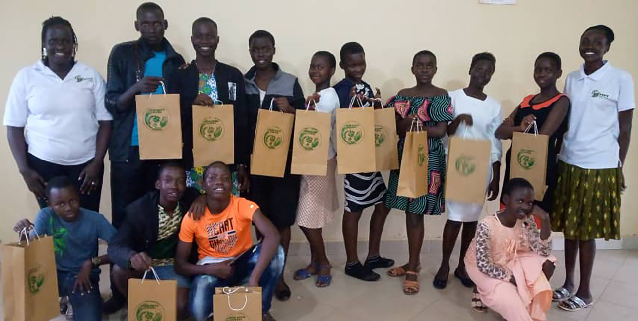 Victory (left) with UNIFAT students who learned each step in the bag-making process. She also shared with them the importance of having a realistic business plan.